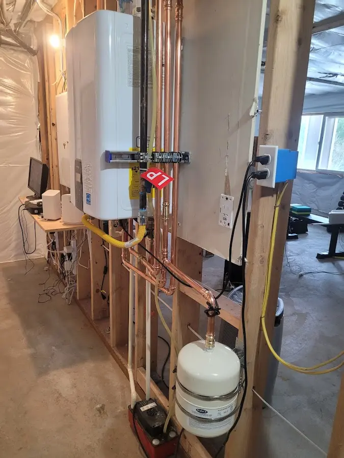 Licensed plumber repairing a kitchen sink in Portage